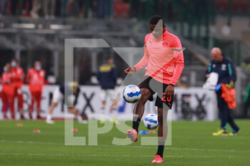 2021-10-16 - Pierre Kalulu of AC Milan warms up during the Serie A 2021/22 football match between AC Milan and Hellas Verona FC at Giuseppe Meazza Stadium, Milan, Italy on October 16, 2021 - AC MILAN VS HELLAS VERONA FC - ITALIAN SERIE A - SOCCER