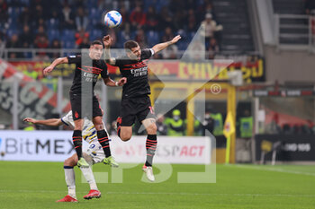 2021-10-16 - Ismael Bennacer of AC Milan and Alessio Romagnoli of AC Milan in action during the Serie A 2021/22 football match between AC Milan and Hellas Verona FC at Giuseppe Meazza Stadium, Milan, Italy on October 16, 2021 - AC MILAN VS HELLAS VERONA FC - ITALIAN SERIE A - SOCCER