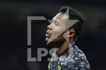 2021-10-24 - Alex Sandro of Juventus FC warms up during the Serie A 2021/22 football match between FC Internazionale and Juventus FC at Giuseppe Meazza Stadium, Milan, Italy on October 24, 2021 - INTER - FC INTERNAZIONALE VS JUVENTUS FC - ITALIAN SERIE A - SOCCER