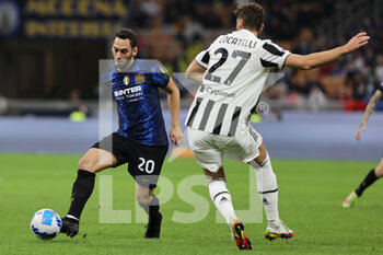 2021-10-24 - Hakan Calhanoglu of FC Internazionale in action during the Serie A 2021/22 football match between FC Internazionale and Juventus FC at Giuseppe Meazza Stadium, Milan, Italy on October 24, 2021 - INTER - FC INTERNAZIONALE VS JUVENTUS FC - ITALIAN SERIE A - SOCCER