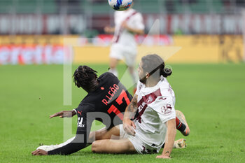 2021-10-26 - Rafael Leao of AC Milan fights for the ball against Ricardo Rodriguez of Torino FC during the Serie A 2021/22 football match between AC Milan and Torino FC at Giuseppe Meazza Stadium, Milan, Italy on October 26, 2021 - AC MILAN VS TORINO FC - ITALIAN SERIE A - SOCCER