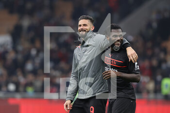 2021-10-26 - Olivier Giroud of AC Milan and Franck Kessie of AC Milan celebrate the victory at the end of the match during the Serie A 2021/22 football match between AC Milan and Torino FC at Giuseppe Meazza Stadium, Milan, Italy on October 26, 2021 - AC MILAN VS TORINO FC - ITALIAN SERIE A - SOCCER