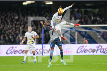 2021-11-07 - Adrien Temeze (61) Hellas Verona
heads the ball as fighting with Victor Osimhen (9) SSC Napoli 1926 during the Italian soccer Serie A 2021/2022 match SSC Napoli vs Hellas Verona on November 7, 2021 at the Stadium Diego Armando Maradona in Naples, Italy - SSC NAPOLI VS HELLAS VERONA FC - ITALIAN SERIE A - SOCCER