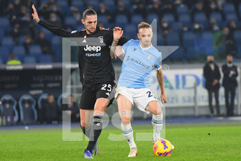 2021-11-20 - ROME, ITALY -  November 20 :  Manuel Lazzari (R) of  SS Lazio in action against  Adrien Rabiot (L) of  FC Juventus during the  Serie A  soccer match between  SS Lazio and FC Juventus Stadio Olimpico on October 27,2021 in Rome, Italy - SS LAZIO VS JUVENTUS FC - ITALIAN SERIE A - SOCCER