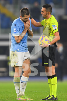 2021-11-20 - ROME, ITALY - November 20 : The Referee Marco Guida gestures at Francesco Acerbi SS Lazio during Italian Serie A soccer match at between  SS Lazio and FC Juventus  Stadio Olimpico on November 20,2021 in Rome Italy - SS LAZIO VS JUVENTUS FC - ITALIAN SERIE A - SOCCER