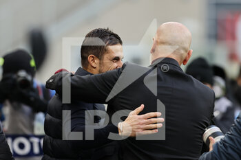 2021-11-28 - Alessio Dionisi Head Coach of of US Sassuolo hugs Stefano Pioli Head Coach of AC Milan during the Serie A 2021/22 football match between AC Milan and US Sassuolo at Giuseppe Meazza Stadium, Milan, Italy on November 28, 2021 - AC MILAN VS US SASSUOLO - ITALIAN SERIE A - SOCCER