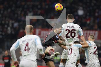 2021-12-04 - Alessio Romagnoli of AC Milan fights for the ball against Luka Bogdan of US Salernitana 1919 during the Serie A 2021/22 football match between AC Milan and US Salernitana 1919 at Giuseppe Meazza Stadium, Milan, Italy on December 04, 2021 - AC MILAN VS US SALERNITANA - ITALIAN SERIE A - SOCCER