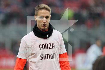 2021-12-04 - Andrea Conti of AC Milan warms up during the Serie A 2021/22 football match between AC Milan and US Salernitana 1919 at Giuseppe Meazza Stadium, Milan, Italy on December 04, 2021 - AC MILAN VS US SALERNITANA - ITALIAN SERIE A - SOCCER