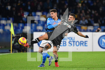 2021-12-12 - Napoli's defender Giovanni Di Lorenzo compete for the ball with Empoli's forward Patrick Cutrone  - SSC NAPOLI VS EMPOLI FC - ITALIAN SERIE A - SOCCER