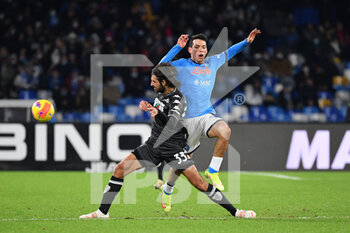 2021-12-12 - Empoli's midfielder Leo Stulac compete for the ball with Napoli's forward Adam Ounas  - SSC NAPOLI VS EMPOLI FC - ITALIAN SERIE A - SOCCER