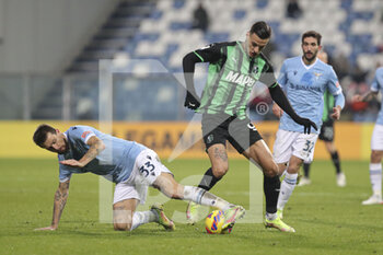 2021-12-12 - Francesco Acerbi (Lazio) takes the ball with a tackle on Gianluca Scamacca (Sassuolo) - US SASSUOLO VS SS LAZIO - ITALIAN SERIE A - SOCCER