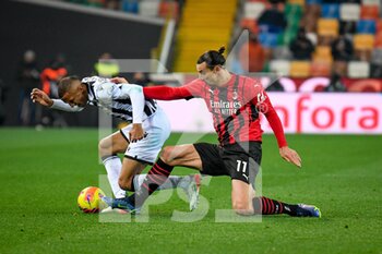 2021-12-11 - Foul of Milan's Zlatan Ibrahimovic (Milan) on Udinese's Rodrigo Nascimento Becao - UDINESE CALCIO VS AC MILAN - ITALIAN SERIE A - SOCCER