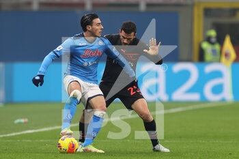 2021-12-19 - Eljif Elamas of SSC Napoli fights for the ball against Alessando Florenzi of AC Milan during the Serie A 2021/22 football match between AC Milan and SSC Napoli at Giuseppe Meazza Stadium, Milan, Italy on December 19, 2021 - AC MILAN VS SSC NAPOLI - ITALIAN SERIE A - SOCCER