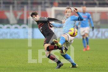 2021-12-19 - Brahim Diaz of AC Milan fights for the ball against Stanislav Lobotka of SSC Napoli during the Serie A 2021/22 football match between AC Milan and SSC Napoli at Giuseppe Meazza Stadium, Milan, Italy on December 19, 2021 - AC MILAN VS SSC NAPOLI - ITALIAN SERIE A - SOCCER