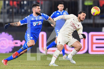 2021-12-22 - Alessandro Florenzi (Milan) and Patrick Cutrone (Empoli) - EMPOLI FC VS AC MILAN - ITALIAN SERIE A - SOCCER