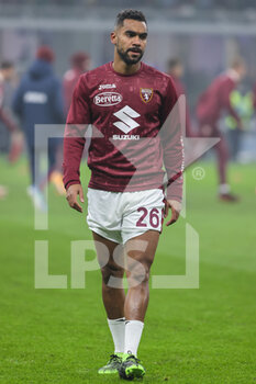 2021-12-22 - Koffi Djidji of Torino FC warms up during the Serie A 2021/22 football match between FC Internazionale and Torino FC at Giuseppe Meazza Stadium, Milan, Italy on December 22, 2021 - INTER - FC INTERNAZIONALE VS TORINO FC - ITALIAN SERIE A - SOCCER