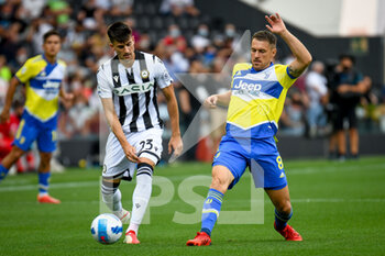 2021-08-22 - Ignacio Pussetto (Udinese) in action against Aaron Ramsey (Juventus) - UDINESE CALCIO VS JUVENTUS FC - ITALIAN SERIE A - SOCCER