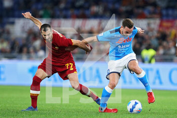 2021-10-24 - Henrikh Mkhitaryan of Roma(L) vies for the ball with Fabian Ruiz of Napoli (R) during the Italian championship Serie A football match between AS Roma and SSC Napoli on October 24, 2021 at Stadio Olimpico in Rome, Italy - AS ROMA VS SSC NAPOLI - ITALIAN SERIE A - SOCCER