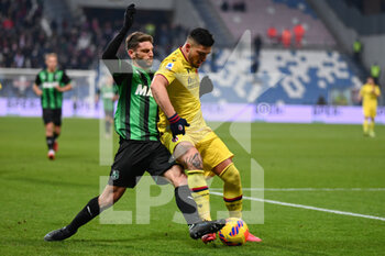 2021-12-22 - Domenico Berardi (Sassuolo) in action against Kevin Bonifazi (Bologna Fc) - US SASSUOLO VS BOLOGNA FC - ITALIAN SERIE A - SOCCER