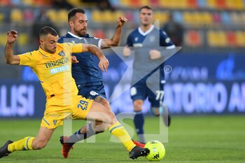 2021-12-18 - FROSINONE, ITALY -  December 18 :  Matteo Cotali (L) of  Frosinone in action against  Lorenzo Colombo  (R) of  Spal during the  Serie B  soccer match between  Frosinone and Spal Stadio Benito Stirpe on December 18,2021 in Frosinone Italy - FROSINONE CALCIO VS SPAL - ITALIAN SERIE B - SOCCER