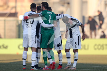 2021-12-18 - Gianluigi Buffon (Parma Calcio 1913) hugs Elias Cobbaut (Parma Calcio 1913) and other teammates after the victory - US ALESSANDRIA VS PARMA CALCIO - ITALIAN SERIE B - SOCCER