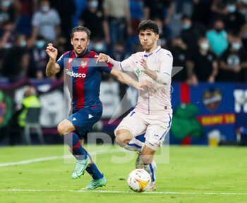 2021-10-16 - Jorge Miramon of Levante and Carles Alena of Getafe during the Spanish championship Liga football match between Levante UD and Getafe CF on October 16, 2021 at the Ciutat de Valencia Stadium in Valencia, Spain - LEVANTE UD VS GETAFE CF - SPANISH LA LIGA - SOCCER