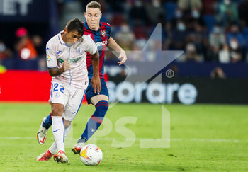2021-10-16 - Damian Suarez of Getafe and Carlos Clerc of Levante UD in action during the Spanish championship Liga football match between Levante UD and Getafe CF on October 16, 2021 at the Ciutat de Valencia Stadium in Valencia, Spain - LEVANTE UD VS GETAFE CF - SPANISH LA LIGA - SOCCER