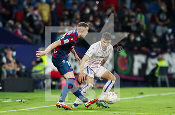 2021-10-16 - Carlos Clerc of Levante UD and Mauro Arambarri of Getafe in action during the Spanish championship Liga football match between Levante UD and Getafe CF on October 16, 2021 at the Ciutat de Valencia Stadium in Valencia, Spain - LEVANTE UD VS GETAFE CF - SPANISH LA LIGA - SOCCER