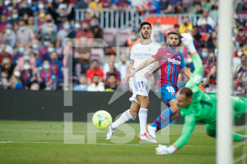 2021-10-24 - Marco Asensio of Real Madrid and Jordi Alba of FC Barcelona during the Spanish championchip La Liga football match between FC Barcelona and Real Madrid on October 24, 2021 at Camp Nou stadium in Barcelona, Spain - FC BARCELONA VS REAL MADRID - SPANISH LA LIGA - SOCCER