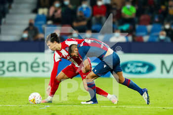 2021-10-28 - Joao Felix of Atletico de Madrid and Rober Pier of Levante UD during the Spanish championship Liga football match between Levante UD and Atletico de Madrid on October 28, 2021 at the Ciutat de Valencia Stadium in Valencia, Spain - LEVANTE UD VS ATLETICO DE MADRID - SPANISH LA LIGA - SOCCER