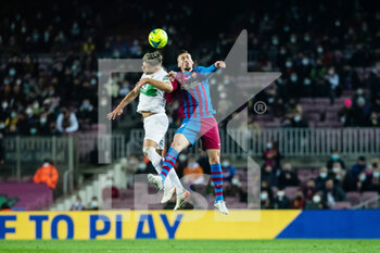 2021-12-18 - Raul Guti of Elche and Clement Lenglet of FC Barcelona during the Spanish championship La Liga football match between FC Barcelona and Elche CF on December 18, 2021 at Camp Nou stadium in Barcelona, Spain - FC BARCELONA VS ELCHE CF - SPANISH LA LIGA - SOCCER