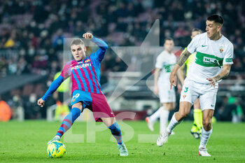 2021-12-18 - Ferran Jutlga Blanc of FC Barcelona and Enzo Andia of Elche during the Spanish championship La Liga football match between FC Barcelona and Elche CF on December 18, 2021 at Camp Nou stadium in Barcelona, Spain - FC BARCELONA VS ELCHE CF - SPANISH LA LIGA - SOCCER