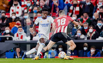 2021-12-22 - Vinicius Junior of Real Madrid and Oscar De Marcos of Athletic Club during the Spanish championship La Liga football match between Athletic Club and Real Madrid CF on December 22, 2021 at San Mames stadium in Bilbao, Spain - ATHLETIC CLUB VS REAL MADRID CF - SPANISH LA LIGA - SOCCER