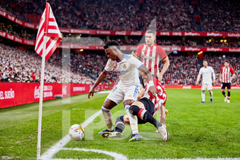 2021-12-22 - Vinicius Junior of Real Madrid and Raul Garcia of Athletic Club during the Spanish championship La Liga football match between Athletic Club and Real Madrid CF on December 22, 2021 at San Mames stadium in Bilbao, Spain - ATHLETIC CLUB VS REAL MADRID CF - SPANISH LA LIGA - SOCCER