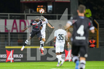 2021-10-27 - 27.10.2021, Lugano, Stadio Cornaredo, 1/8  Final Swiss Cup: FC Lugano - BSC Young Boys, #8 Christopher Lungoyi (Lugano) against #24 Quentin Maceiras (Young Boys) - 1/8 FINALS - FC LUGANO VS BSC YOUNG BOYS - SWISS CUP - SOCCER