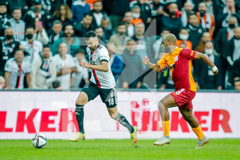 2021-10-25 - Rachid Ghezzal of Besiktas JK, Ryan Babel of Galatasaray during the Turkish championship Super Lig football match between Besiktas and Galatasaray on October 25, 2021 at Vodafone Park in Istanbul, Turkey - BESIKTAS VS GALATASARAY - TURKISH SUPER LEAGUE - SOCCER