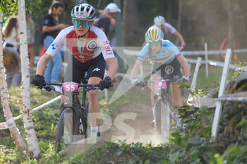 2021-08-28 - (55) - Rebekka Estermann (Switzerland) followed by (8) - Emeline Detilleux (Belgium) - UCI MTB WORLD CHAMPIONSHIP - CROSS COUNTRY - WOMEN U23 RACE - MTB - MOUNTAIN BIKE - CYCLING