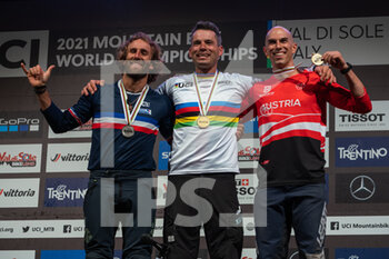 2021-08-27 - Mens podium during the Four Cross (4X), 1st place Tomas SLAVIK of Czech Republic, 2nd place Adrien LORON of France, 3rd place Hannes SLAVIK of Austria, 2021 MTB World Championships, Mountain Bike cycling event on August 27, 2021 in Val Di Sole, Italy - Photo Olly Bowman / DPPI - 2021 MTB WORLD CHAMPIONSHIPS - MTB - MOUNTAIN BIKE - CYCLING