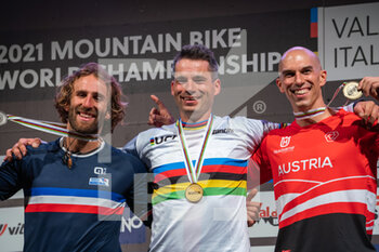 2021-08-27 - Mens podium during the Four Cross (4X), 1st place Tomas SLAVIK of Czech Republic, 2nd place Adrien LORON of France, 3rd place Hannes SLAVIK of Austria, 2021 MTB World Championships, Mountain Bike cycling event on August 27, 2021 in Val Di Sole, Italy - Photo Olly Bowman / DPPI - 2021 MTB WORLD CHAMPIONSHIPS - MTB - MOUNTAIN BIKE - CYCLING