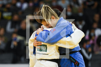 2021-10-16 - Women -48 kg, Milica NIKOLIC bronze medal of Serbia hugs Catarina COSTA of Portugal during the Paris Grand Slam 2021, Judo event on October 16, 2021 at AccorHotels Arena in Paris, France - PARIS GRAND SLAM 2021, JUDO EVENT - JUDO - CONTACT