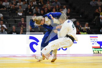 2021-10-16 - Women -63 kg, Angelika SZYMANSKA of Poland (blue) Bronze medal throws Ekaterina VALKOVA of Russia and wins by ippon with a Kouchi Gari (or Ko-Uchi-Gari) during the Paris Grand Slam 2021, Judo event on October 16, 2021 at AccorHotels Arena in Paris, France - PARIS GRAND SLAM 2021, JUDO EVENT - JUDO - CONTACT