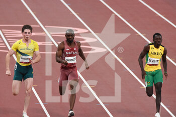 2021-08-01 - Rohan Browning (AUS), Femi Ogunode (QAT), Oblique Seville (JAM) compete on men's 100m semi-final during the Olympic Games Tokyo 2020, Athletics, on August 1, 2021 at Tokyo Olympic Stadium in Tokyo, Japan - Photo Yoann Cambefort / Marti Media / DPPI - OLYMPIC GAMES TOKYO 2020, AUGUST 1, 2021 - OLYMPIC GAMES TOKYO 2020 - OLYMPIC GAMES