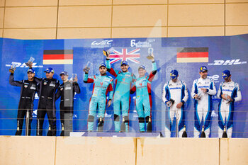 2021-10-30 - 33 Keating Ben (usa), Pereira Dylan (lux), Fraga Felipe (bra), TF Sport, Aston Martin Vantage AMR, 77 Ried Christian (ger), Evans Jaxon (nzl), Campbell Matt (auts), Dempsey-Proton Racing, Porsche 911 RSR - 19, 56 Perfetti Egidio (nor), Cairoli Matteo (ita), Pera Riccardo (ita), Team Project 1, Porsche 911 RSR - 19, podium during the 6 Hours of Bahrain, 5th round of the 2021 FIA World Endurance Championship, FIA WEC, on the Bahrain International Circuit, from October 28 to 30, 2021 in Sakhir, Bahrain - 6 HOURS OF BAHRAIN, 5TH ROUND OF THE 2021 FIA WORLD ENDURANCE CHAMPIONSHIP, FIA WEC - ENDURANCE - MOTORS