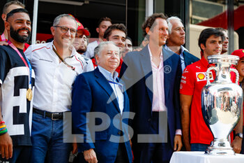 2021-09-12 - The Scuderia Ferrari drivers Leclerc Charles and Sainz Carlos, posing with Italian Olympic Games champions, TODT Jean (fra), FIA President, DOMENICALLI Stefano (ita), Chairman and CEO Formula One Group FOG, and Elkann John, Chairman and Chief Executive Officer of EXOR and Chairman of Fiat Chrysler, in the paddock with the Football Euro 2020 trophy, during the Formula 1 Heineken Gran Premio D'italia 2021, Italian Grand Prix, 14th round of the 2021 FIA Formula One World Championship from September 9 to 12, 2021 on the Autodromo Nazionale di Monza, in Monza, Italy - FORMULA 1 HEINEKEN GRAN PREMIO D'ITALIA 2021, ITALIAN GRAND PRIX, 14TH ROUND OF THE 2021 FIA FORMULA ONE WORLD CHAMPIONSHIP - FORMULA 1 - MOTORS