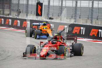 2021-09-26 - 55 SAINZ Carlos (spa), Scuderia Ferrari SF21, action and 04 NORRIS Lando (gbr), McLaren MCL35M during the Formula 1 VTB Russian Grand Prix 2021, 15th round of the 2021 FIA Formula One World Championship from September 24 to 26, 2021 on the Sochi Autodrom, in Sochi, Russia - FORMULA 1 VTB RUSSIAN GRAND PRIX 2021, 15TH ROUND OF THE 2021 FIA FORMULA ONE WORLD CHAMPIONSHIP - FORMULA 1 - MOTORS
