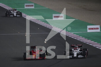 2021-11-21 - 16 LECLERC Charles (mco), Scuderia Ferrari SF21, overtakes 07 RAIKKONEN Kimi (fin), Alfa Romeo Racing ORLEN C41, action during the Formula 1 Ooredoo Qatar Grand Prix 2021, 20th round of the 2021 FIA Formula One World Championship from November 19 to 21, 2021 on the Losail International Circuit, in Lusail, Qatar - FORMULA 1 OOREDOO QATAR GRAND PRIX 2021, 20TH ROUND OF THE 2021 FIA FORMULA ONE WORLD CHAMPIONSHIP - FORMULA 1 - MOTORS