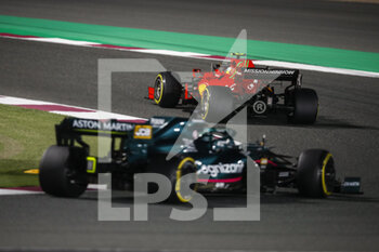 2021-11-21 - 55 SAINZ Carlos (spa), Scuderia Ferrari SF21, action 18 STROLL Lance (can), Aston Martin F1 AMR21, action during the Formula 1 Ooredoo Qatar Grand Prix 2021, 20th round of the 2021 FIA Formula One World Championship from November 19 to 21, 2021 on the Losail International Circuit, in Lusail, Qatar - FORMULA 1 OOREDOO QATAR GRAND PRIX 2021, 20TH ROUND OF THE 2021 FIA FORMULA ONE WORLD CHAMPIONSHIP - FORMULA 1 - MOTORS