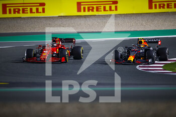 2021-11-21 - 16 LECLERC Charles (mco), Scuderia Ferrari SF21, 11 PEREZ Sergio (mex), Red Bull Racing Honda RB16B, action during the Formula 1 Ooredoo Qatar Grand Prix 2021, 20th round of the 2021 FIA Formula One World Championship from November 19 to 21, 2021 on the Losail International Circuit, in Lusail, Qatar - FORMULA 1 OOREDOO QATAR GRAND PRIX 2021, 20TH ROUND OF THE 2021 FIA FORMULA ONE WORLD CHAMPIONSHIP - FORMULA 1 - MOTORS