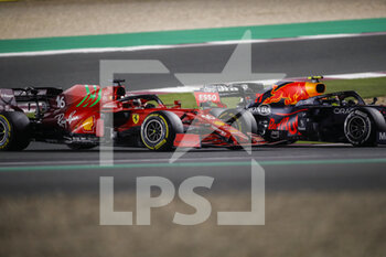 2021-11-21 - 16 LECLERC Charles (mco), Scuderia Ferrari SF21, action 11 PEREZ Sergio (mex), Red Bull Racing Honda RB16B, action during the Formula 1 Ooredoo Qatar Grand Prix 2021, 20th round of the 2021 FIA Formula One World Championship from November 19 to 21, 2021 on the Losail International Circuit, in Lusail, Qatar - FORMULA 1 OOREDOO QATAR GRAND PRIX 2021, 20TH ROUND OF THE 2021 FIA FORMULA ONE WORLD CHAMPIONSHIP - FORMULA 1 - MOTORS