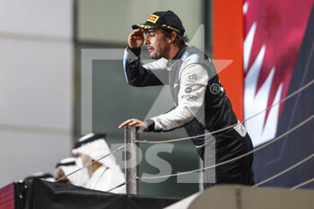 2021-11-21 - ALONSO Fernando (spa), Alpine F1 A521, portrait celebrating his podium during the Formula 1 Ooredoo Qatar Grand Prix 2021, 20th round of the 2021 FIA Formula One World Championship from November 19 to 21, 2021 on the Losail International Circuit, in Lusail, Qatar - FORMULA 1 OOREDOO QATAR GRAND PRIX 2021, 20TH ROUND OF THE 2021 FIA FORMULA ONE WORLD CHAMPIONSHIP - FORMULA 1 - MOTORS